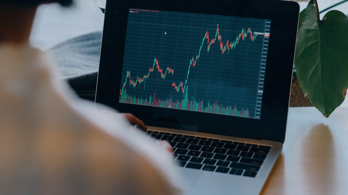 Consultant viewing business share prices